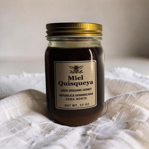 Jar of Quisqueya organic raw honey from the Dominican Republic